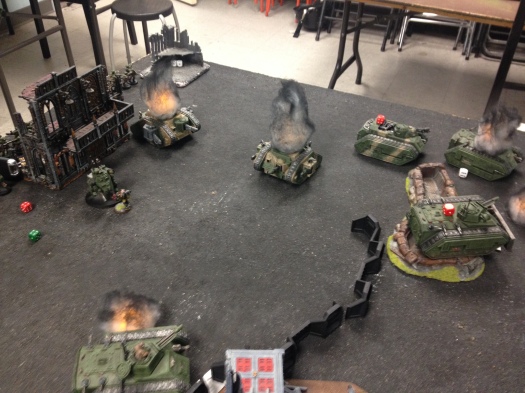 The carnage in the end-game.  The Veterans and Chimera crew occupy the trench-line, while the Command Squad and transport occupy another two points in the Guard backfield.